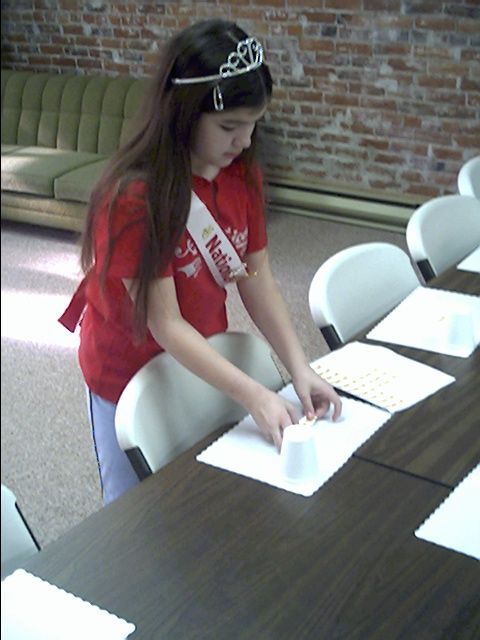 Brittany helping set places at the Pomeroy Senior Center