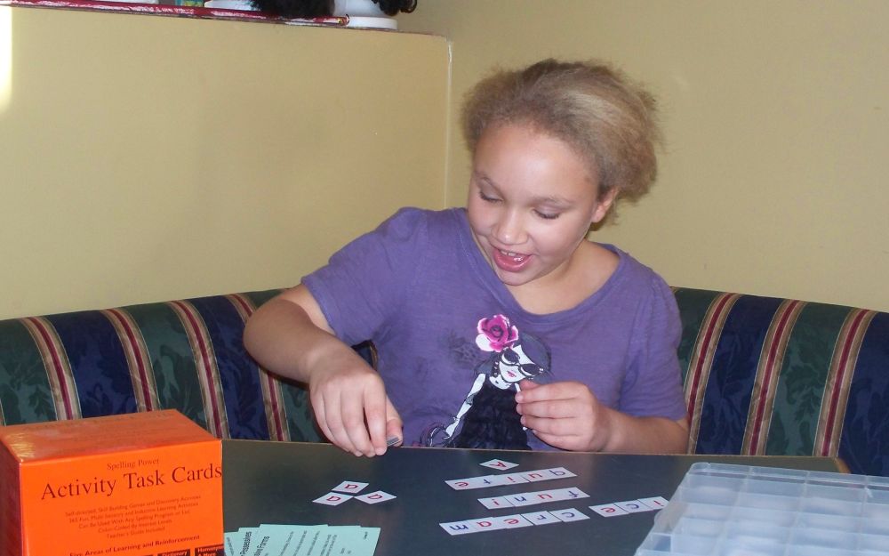 Victoria Sylvester playing with Magnetic Tiles for  
Spelling